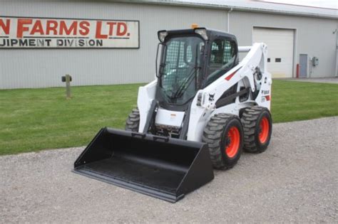 bobcat s650 skid steer bucket 2ont unlock|bobcat hydraulic bucket locking.